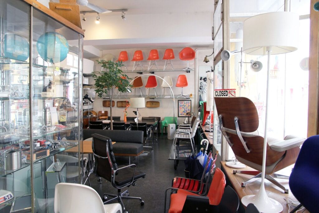 hannibal shop interior armchair, chairs and display case, eames lounge chair
