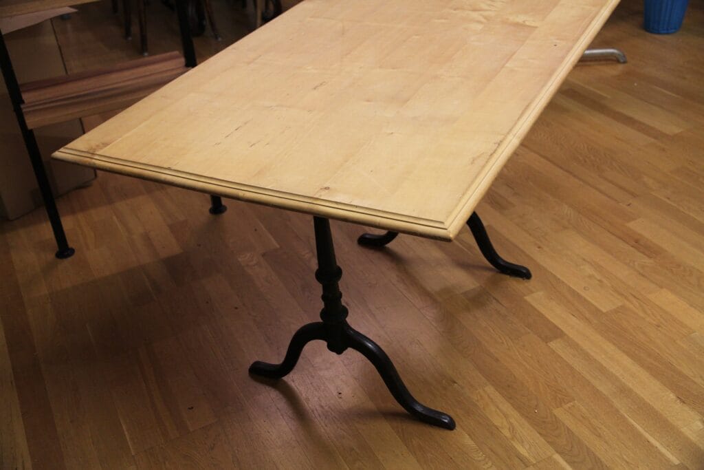 Wooden table with cast iron legs